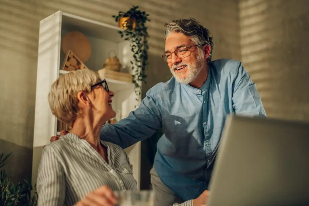 Retirement homes in Las Vegas - Couple using laptop at home