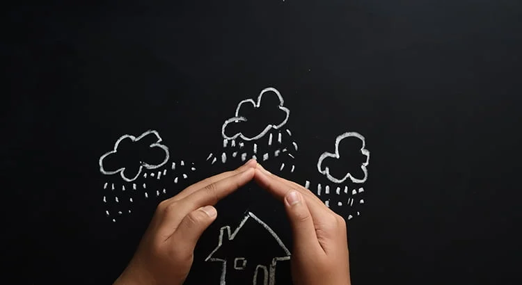 Las Vegas real estate foreclosures - hands covering home from rain